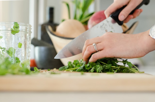 chopping herbs in the kitchen