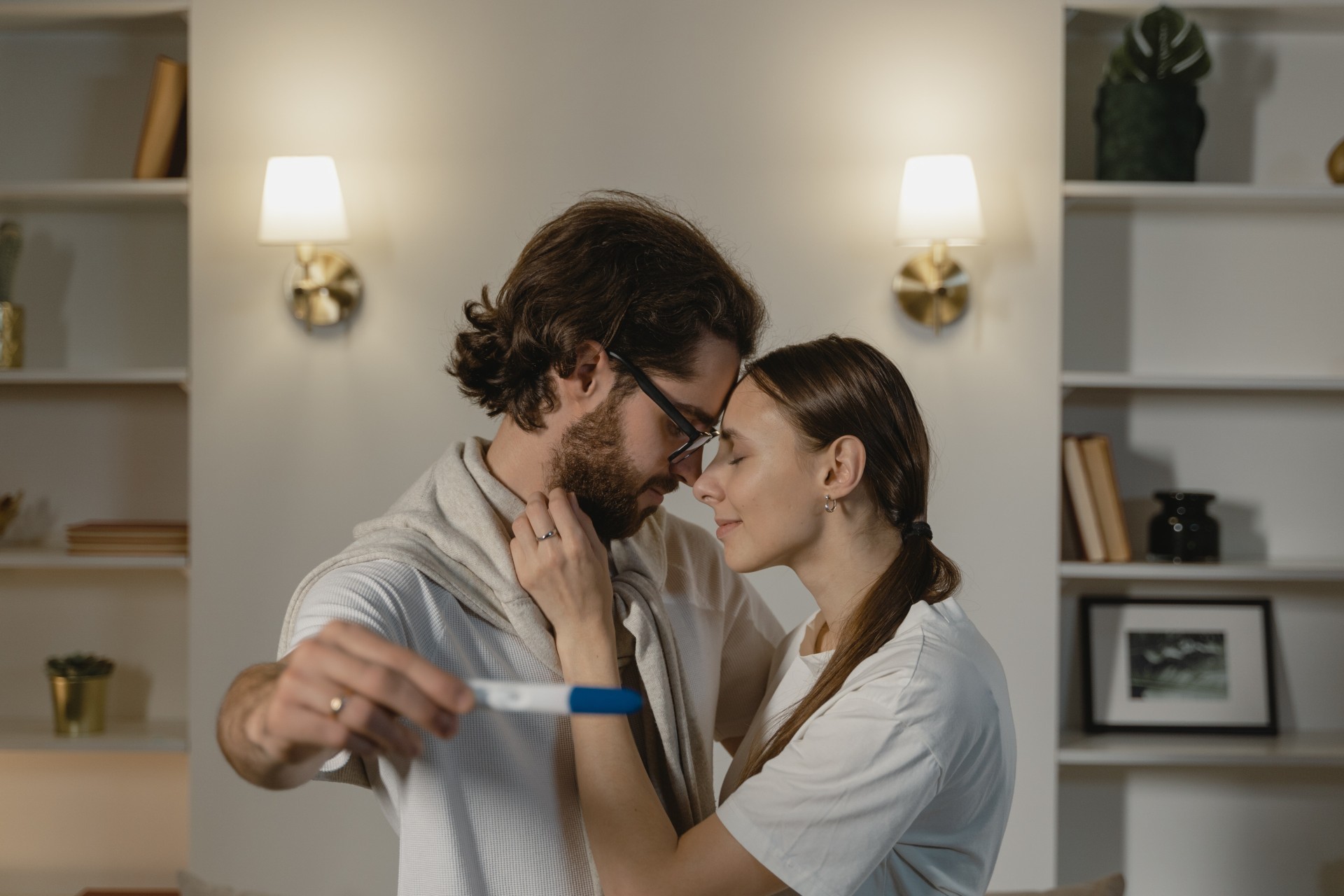 man and women holding a pregnancy test