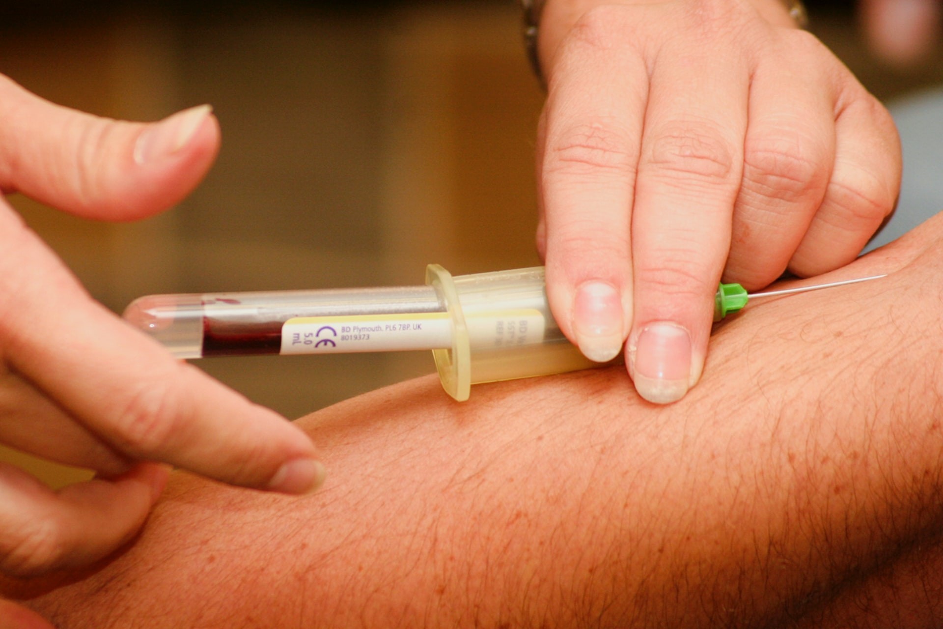 Blood being drawn from a patient into a test tube