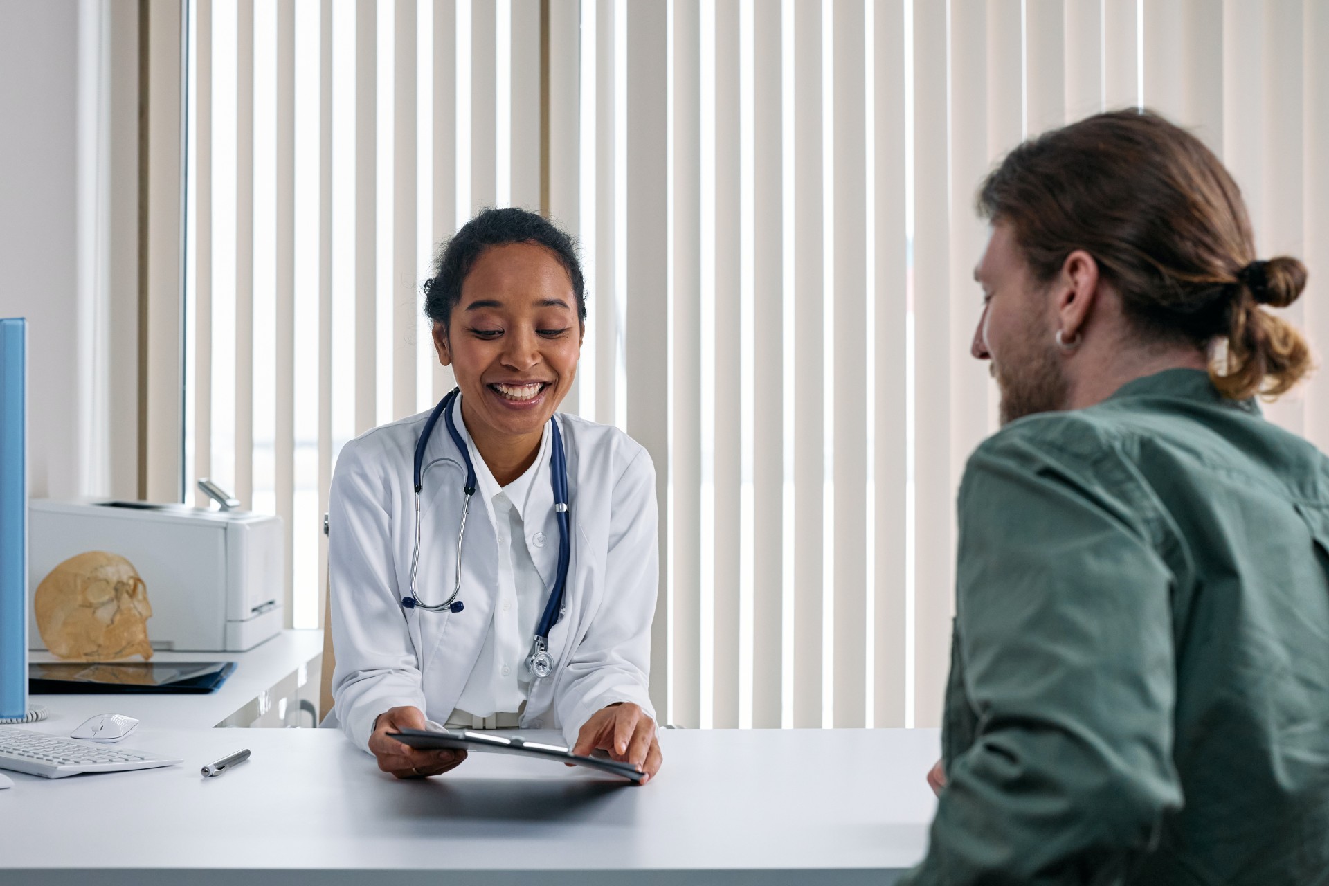 Doctor speaking to patient about booster shot