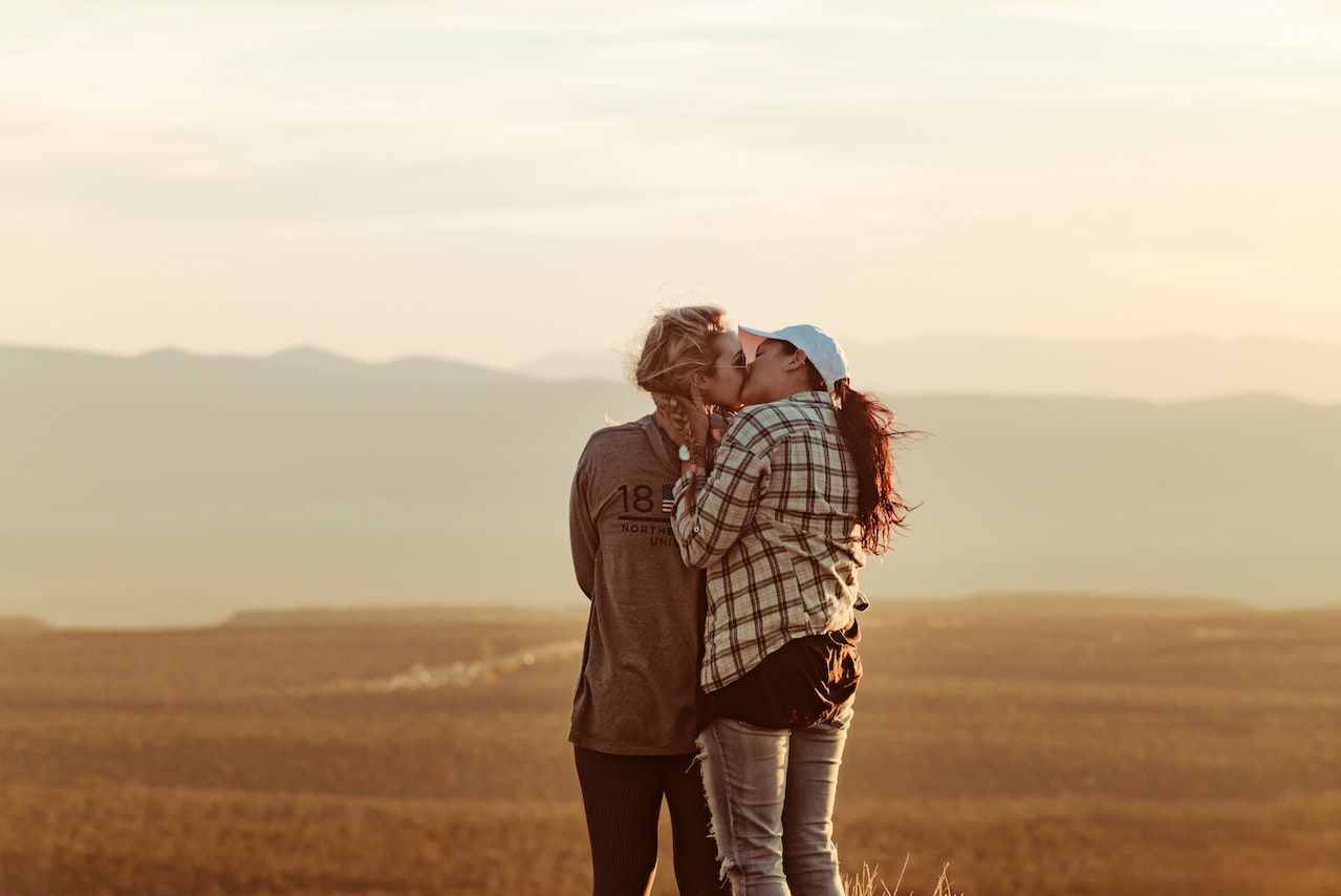 Two women embracing and kissing each other