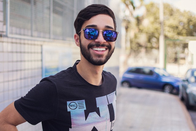 smiling man wearing sunglasses