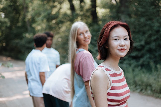 teenage girls outside with friends