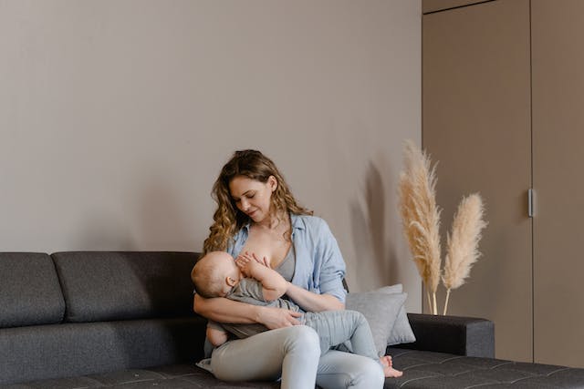 Woman breastfeeding her son