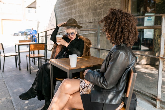 two women having coffee outside