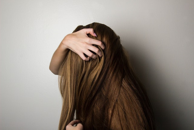 woman playing with her hair